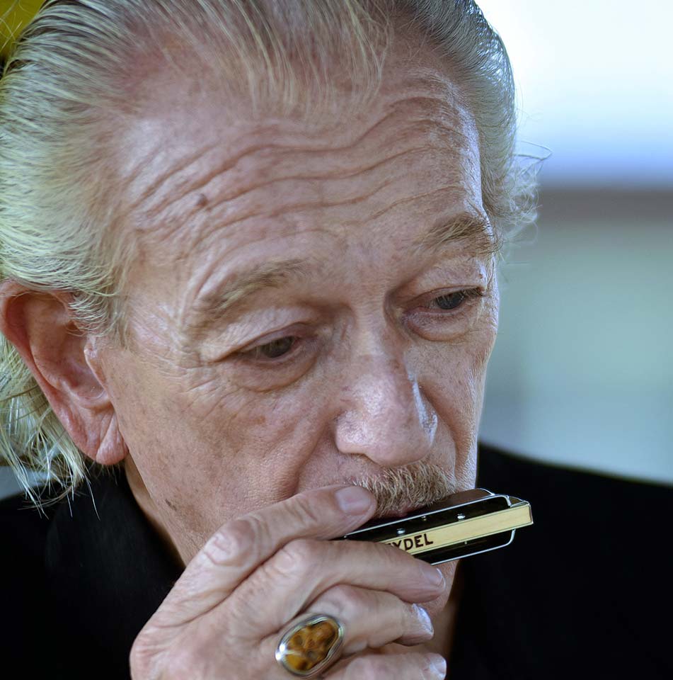 Charlie Musselwhite playing the harmonica