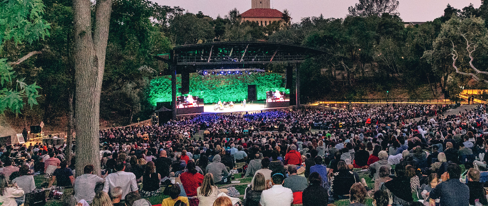 An image of Stanford's Frost Amphitheatre promoting SFJAZZ's upcoming series of LIVE performances at Stanford's Frost Amphitheatre