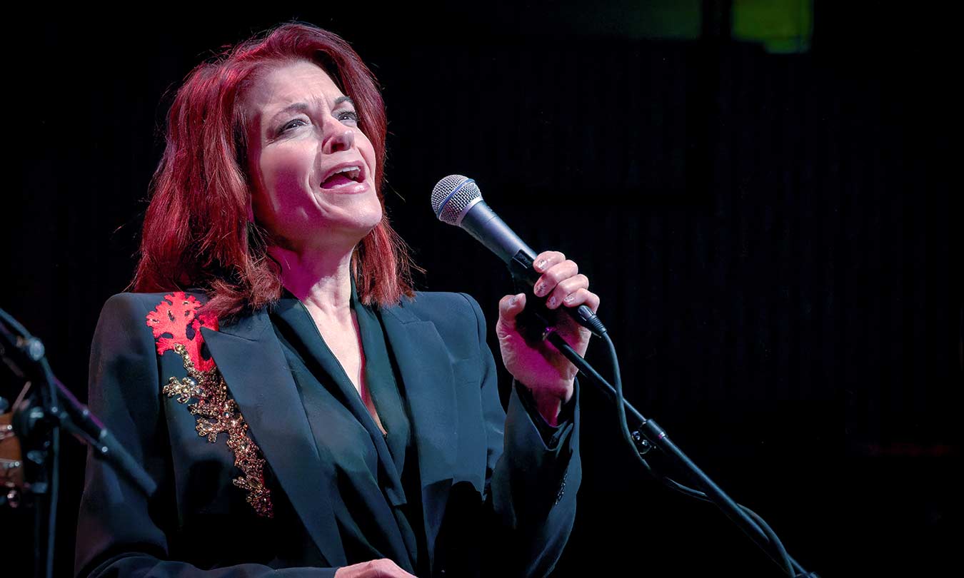 Rosanne Cash performing on stage
